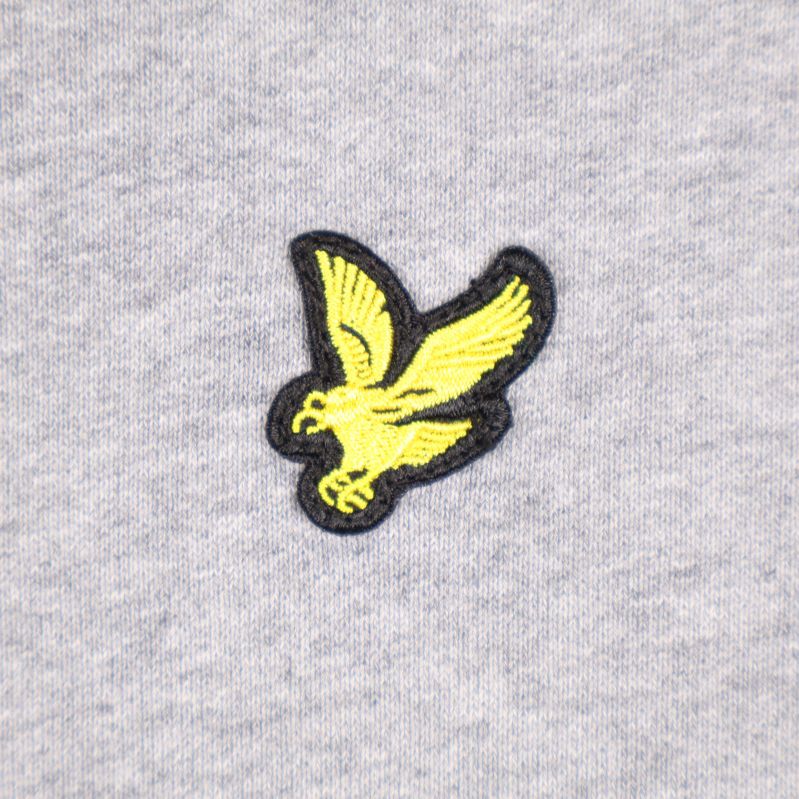 Detalj av ett fågellogo på sweatshirt