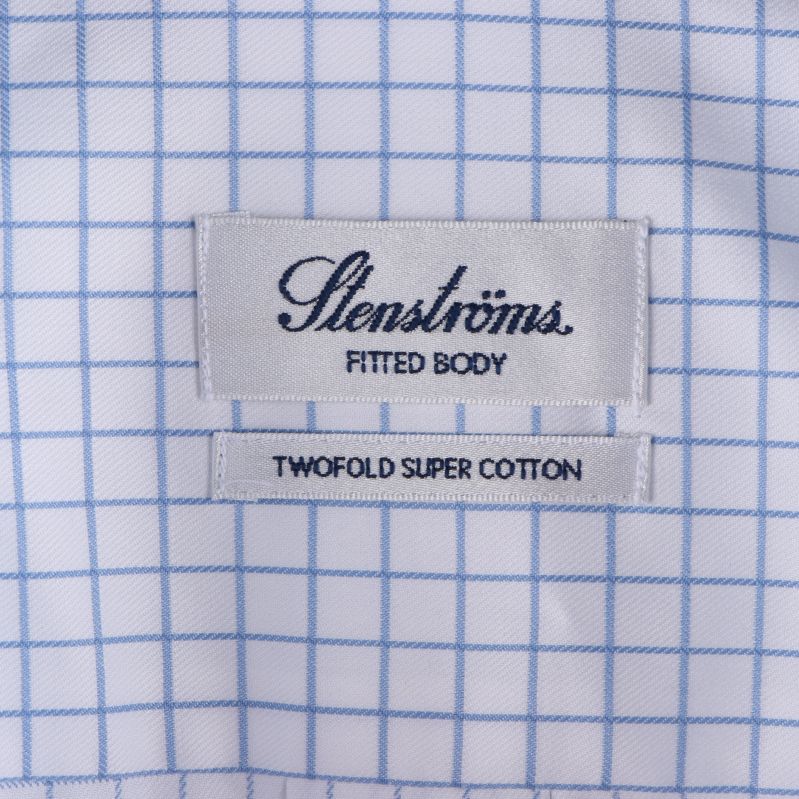 Etikett med Stenströms logga och materialinformation