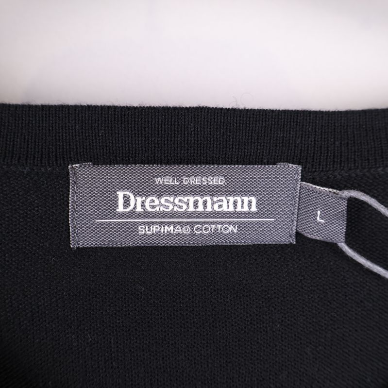 Dressmann-logga med materialdetaljer på etikett