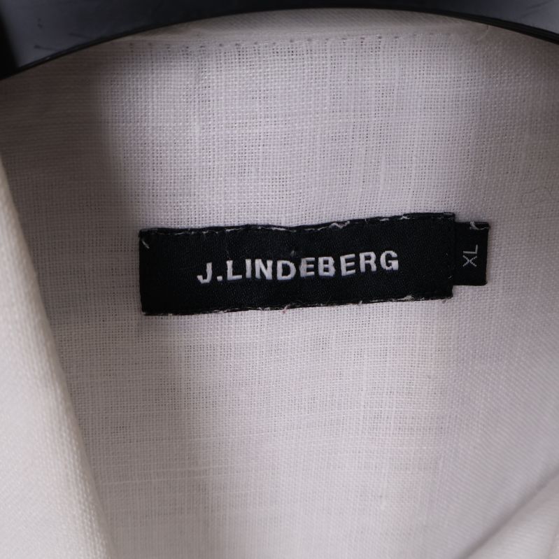 J.Lindeberg märkesetikett på vit skjorta