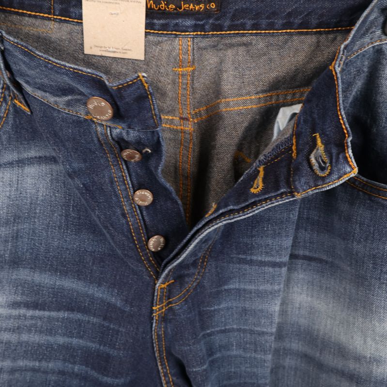 Insida av jeans med knappar