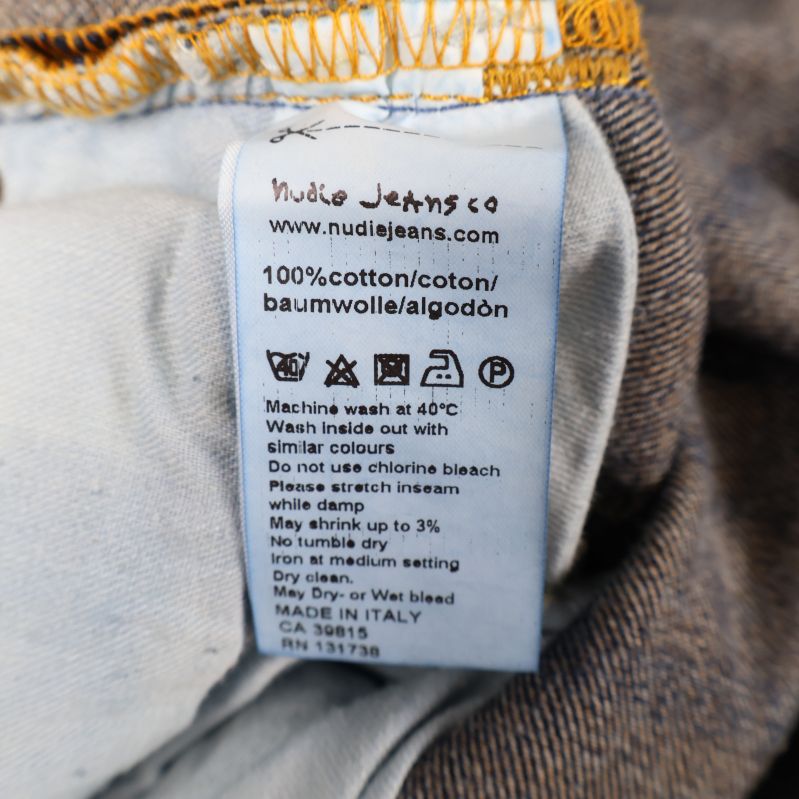 Materiallabel som visar 100% bomull