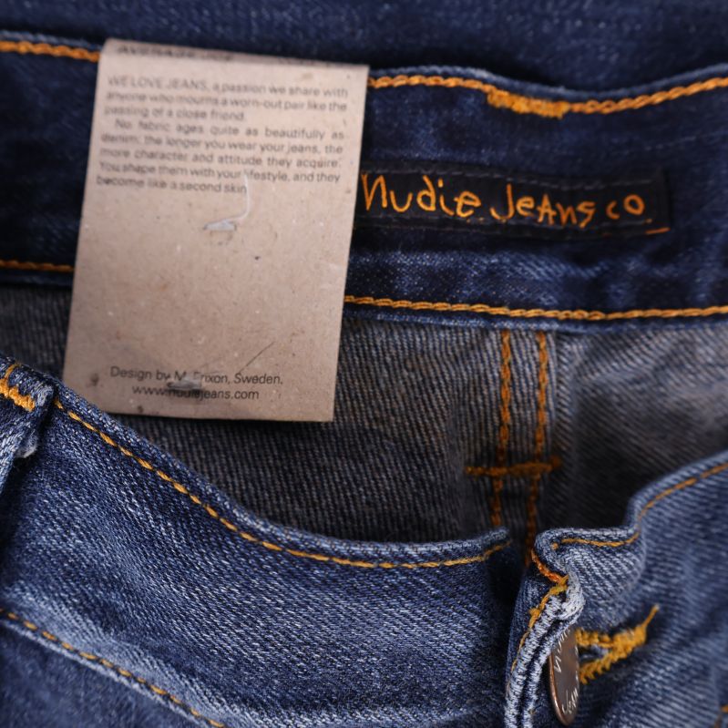 Nudie Jeans logotyp på innerfickan