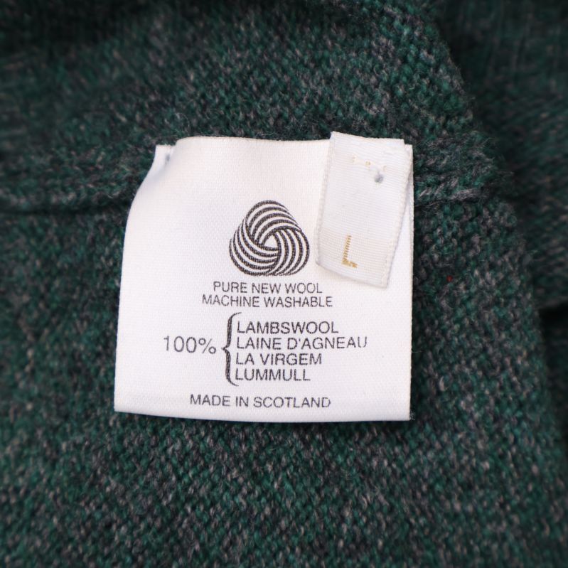 Tvättlapp med materialinformation '100% lammull'