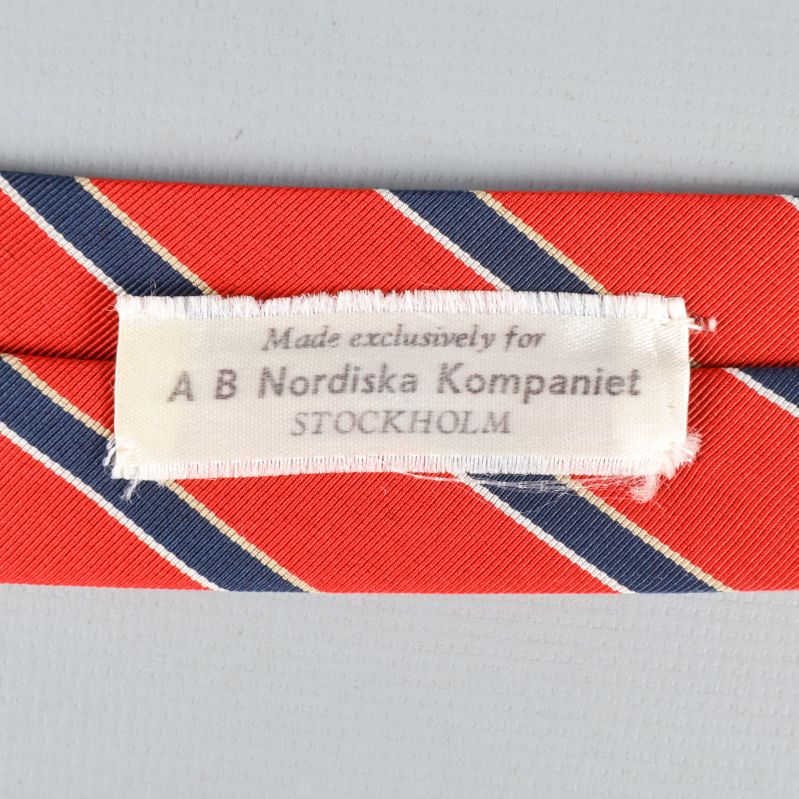 Etikett från AB Nordiska Kompaniet Stockholm