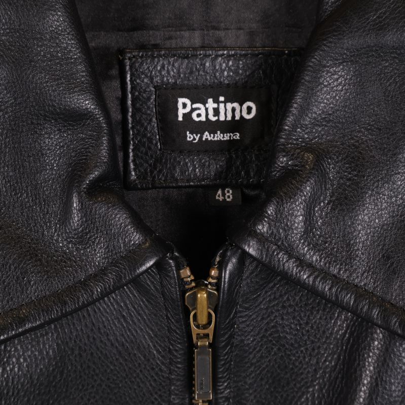 Närbild på etikett med texten Patino by Ankena, storlek 48