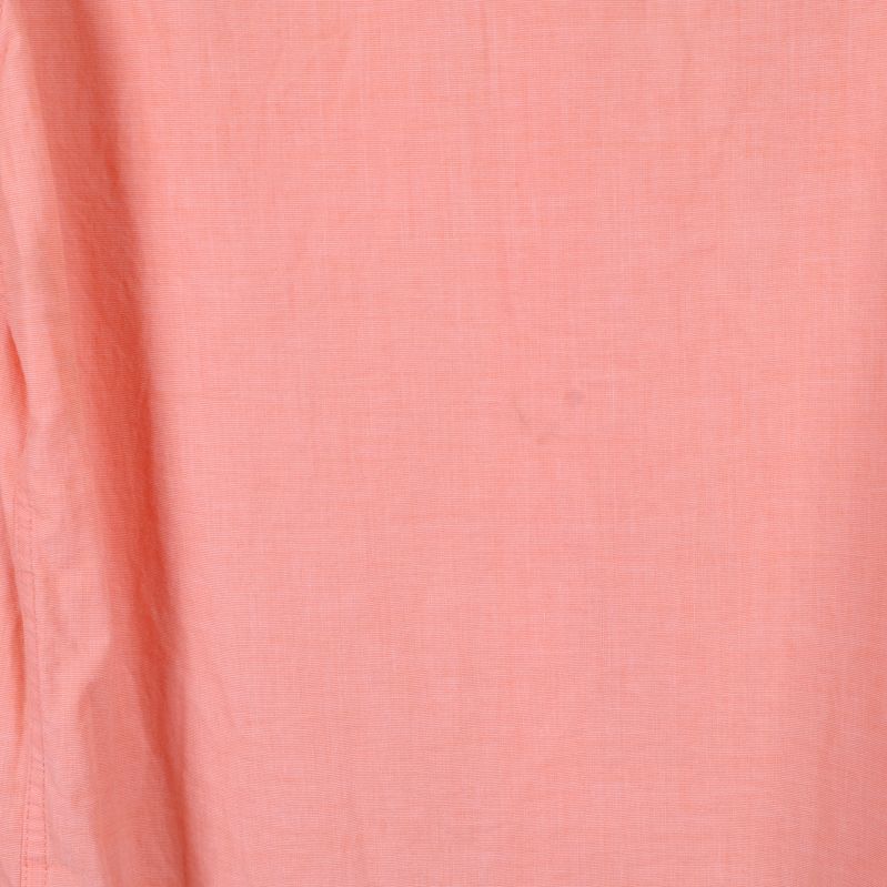 Detalj av aprikos tyg med diskret struktur