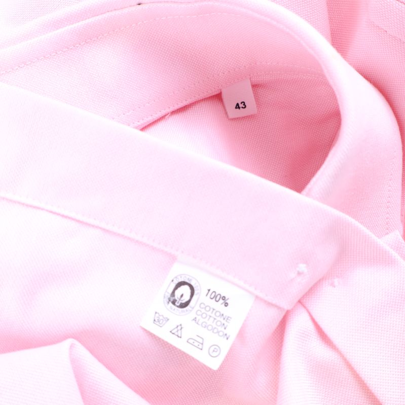 Etikett med materialinformation 100% bomull och storlek 43