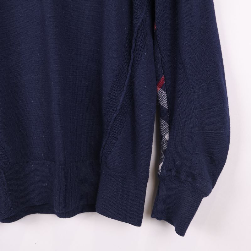 Närbild på höger ärms mudddel med argylemönster