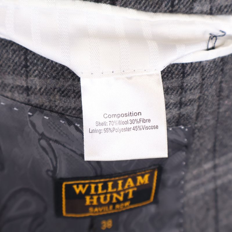 Materialetikett med komposition inuti kavajen