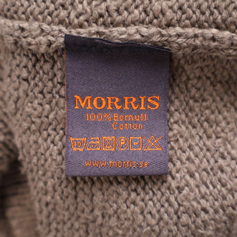 Materialetikett med information om 100% bomull från Morris