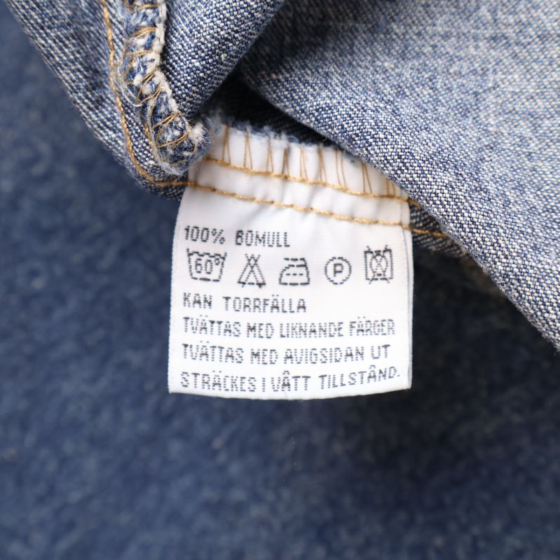 Materiallapp med text 100% bomull och tvättråd