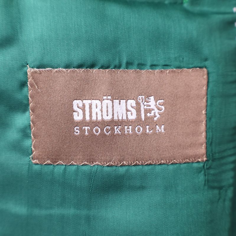 Ströms Stockholm etikett på grönt foder