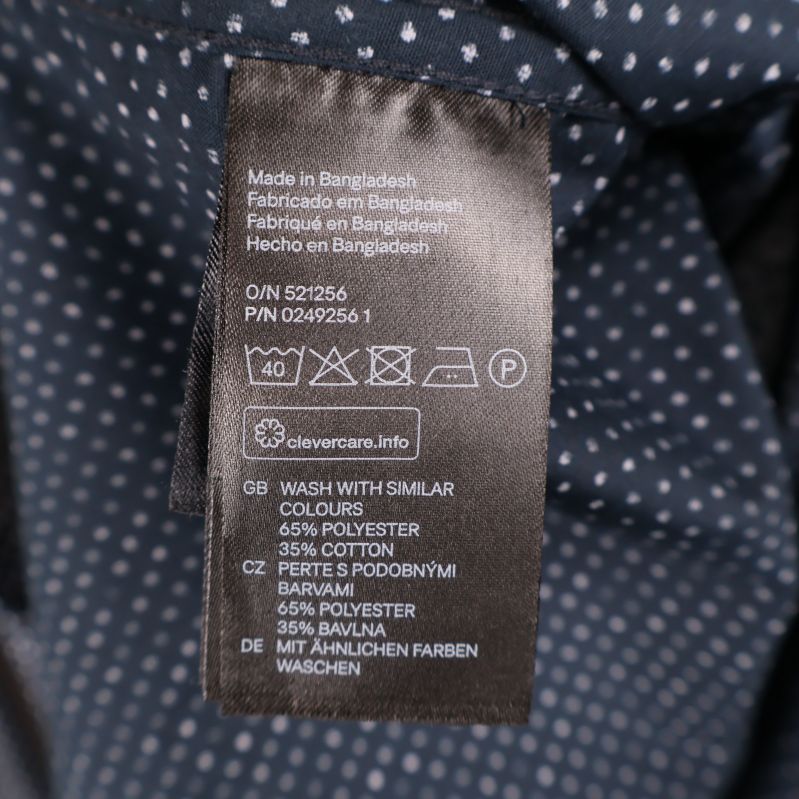 Tvättlapp med materialinformation: 65% polyester, 35% bomull