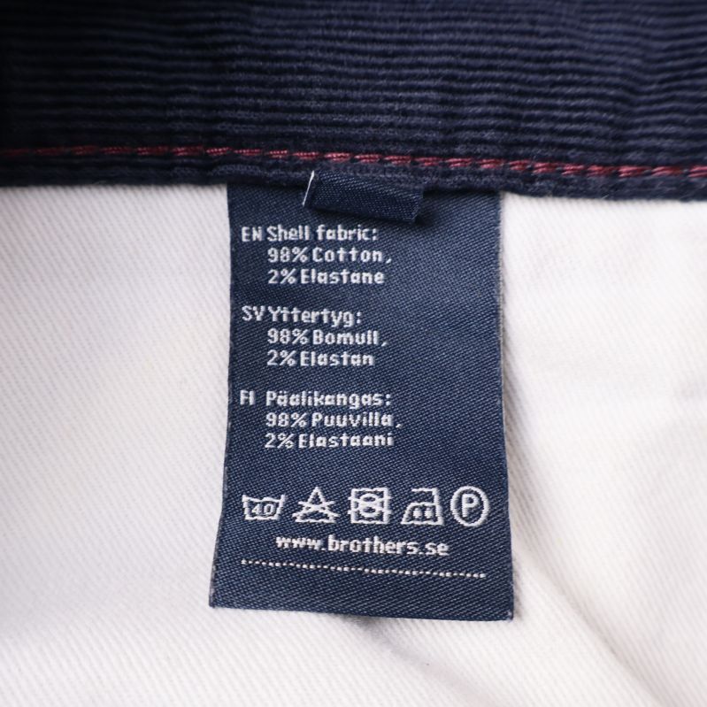 Material- och tvättrådsetikett med bomull och elastan