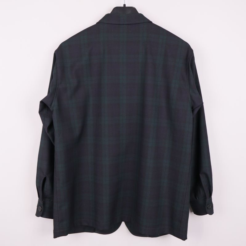 Baksida av rutig kavaj i mörka färger med lång ärm