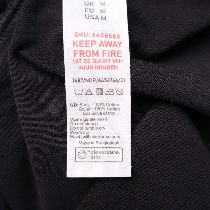 Tvättlapp visar 100% bomull och skötselråd