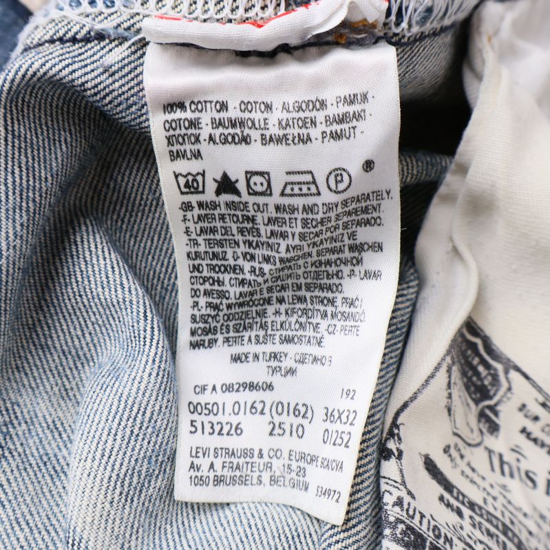 Materialetikett med tvättråd och bomullsandel