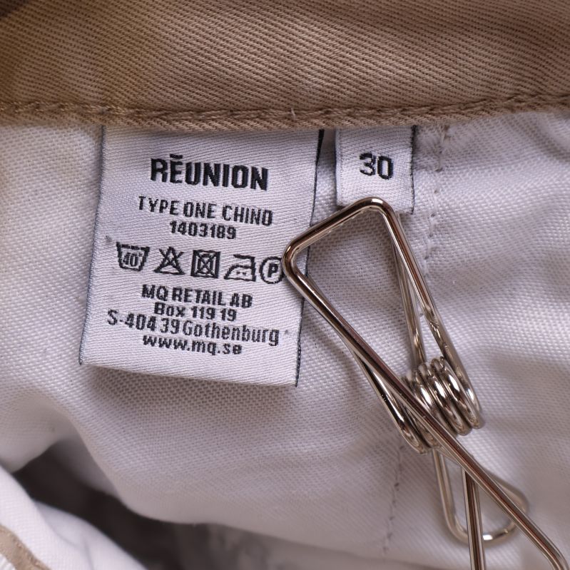 Tvättrådslapp med storlek och företagsinformation