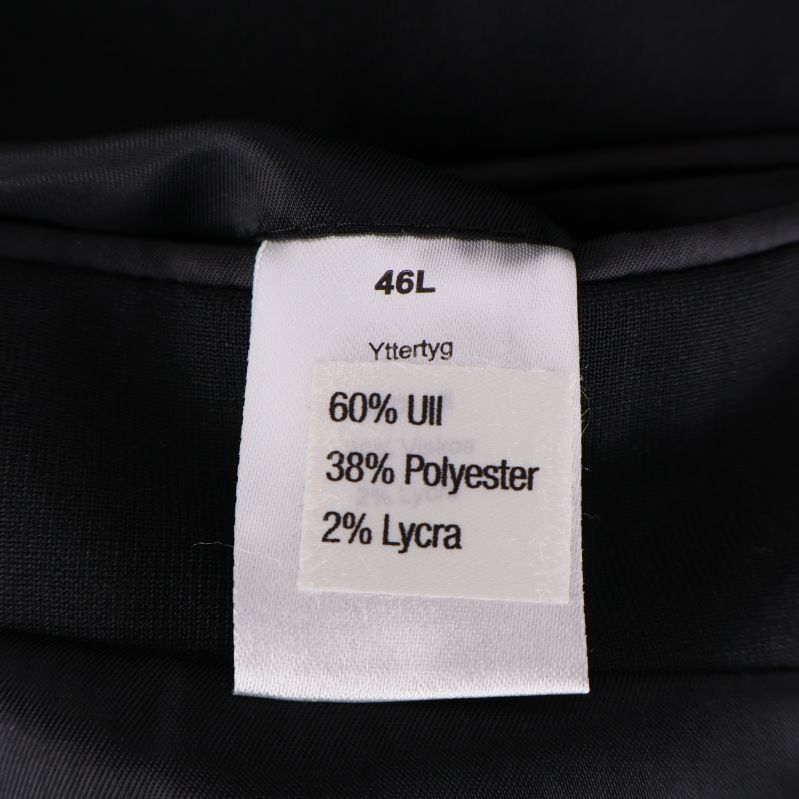 Materialetikett med innehåll: 60% ull, 38% polyester, 2% lycra