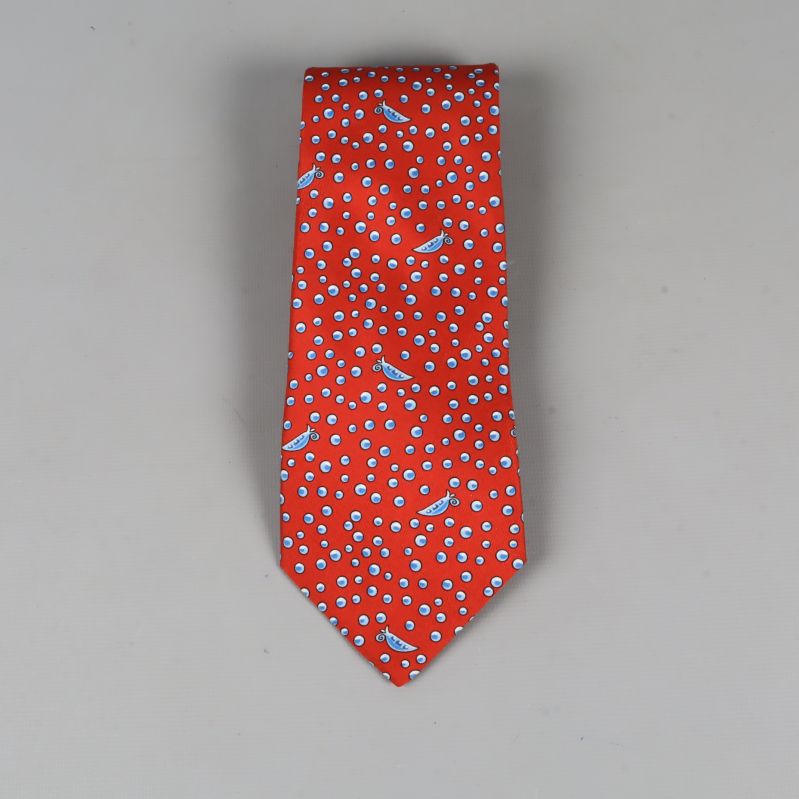 Röd slips med blåprickigt mönster