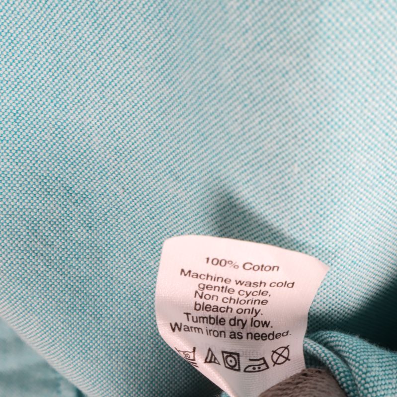 Materialetikett och tvättrådsinformation 100% Cotton