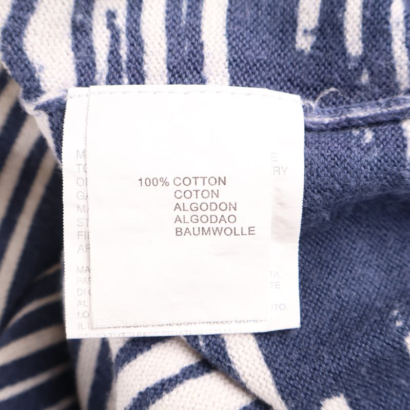 Materiallapp med texten 100% bomull
