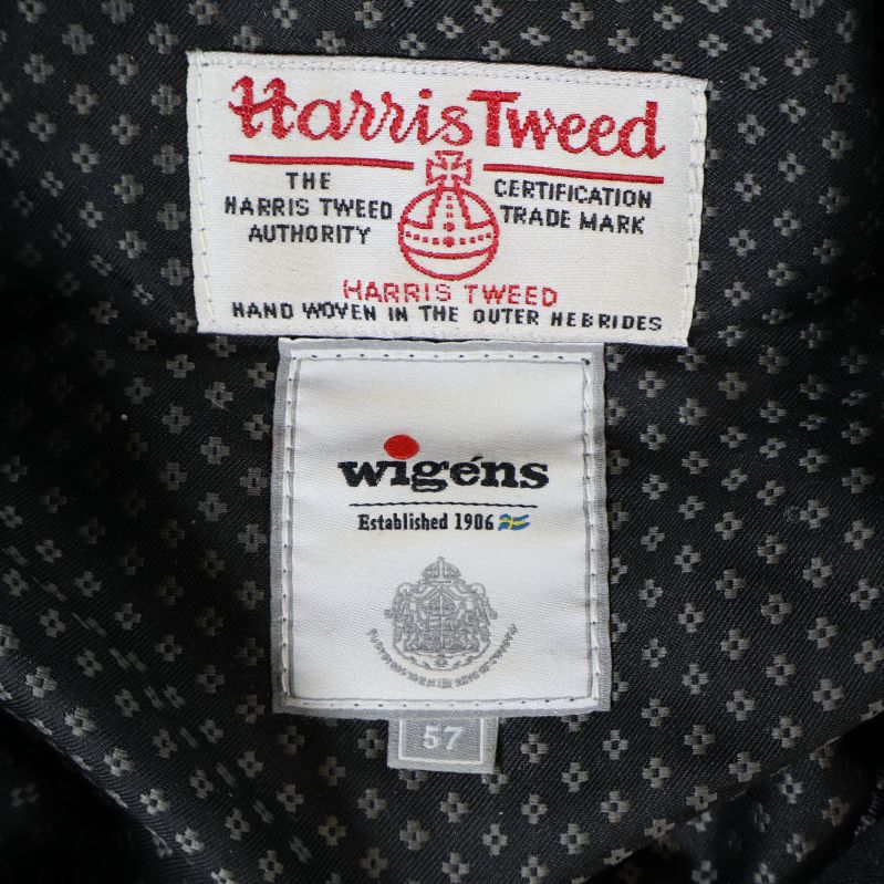 Närbild på Harris Tweed och Wigens etiketter i kepsen