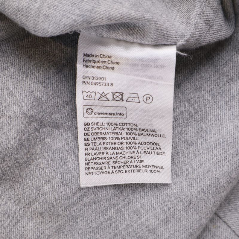 Material- och tvättrådsetikett för skjortan