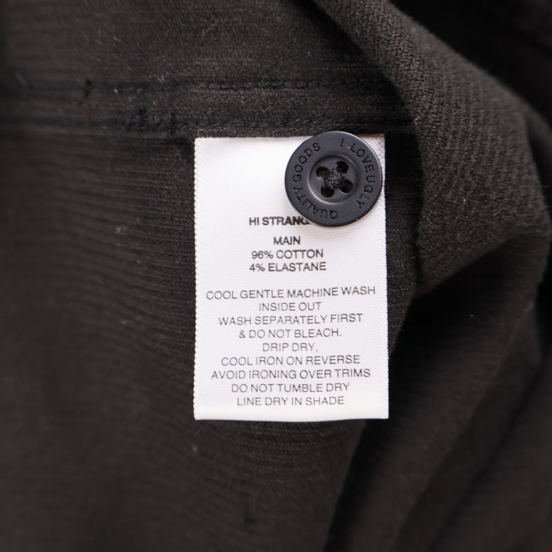 Materiallapp visar 96% bomull och 4% elastan