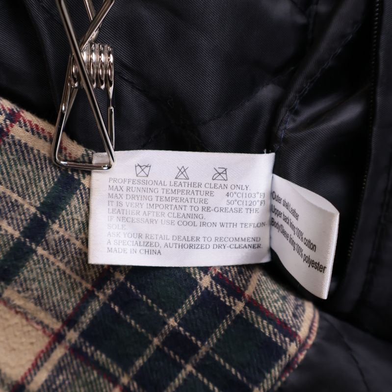 Tvättrådsetikett för skinnjacka med engelsk text