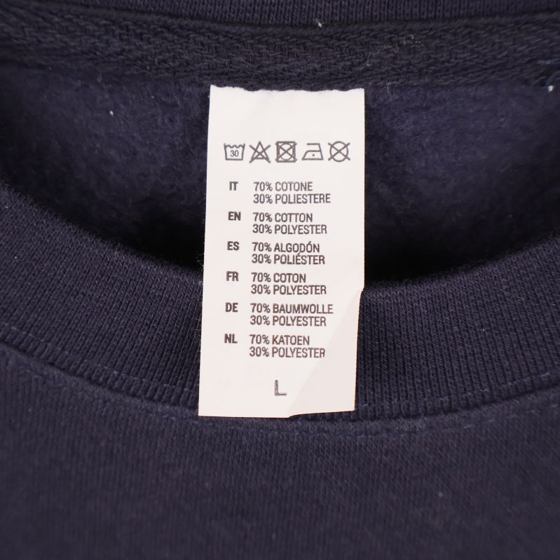 Materiallapp som visar 70% bomull och 30% polyester