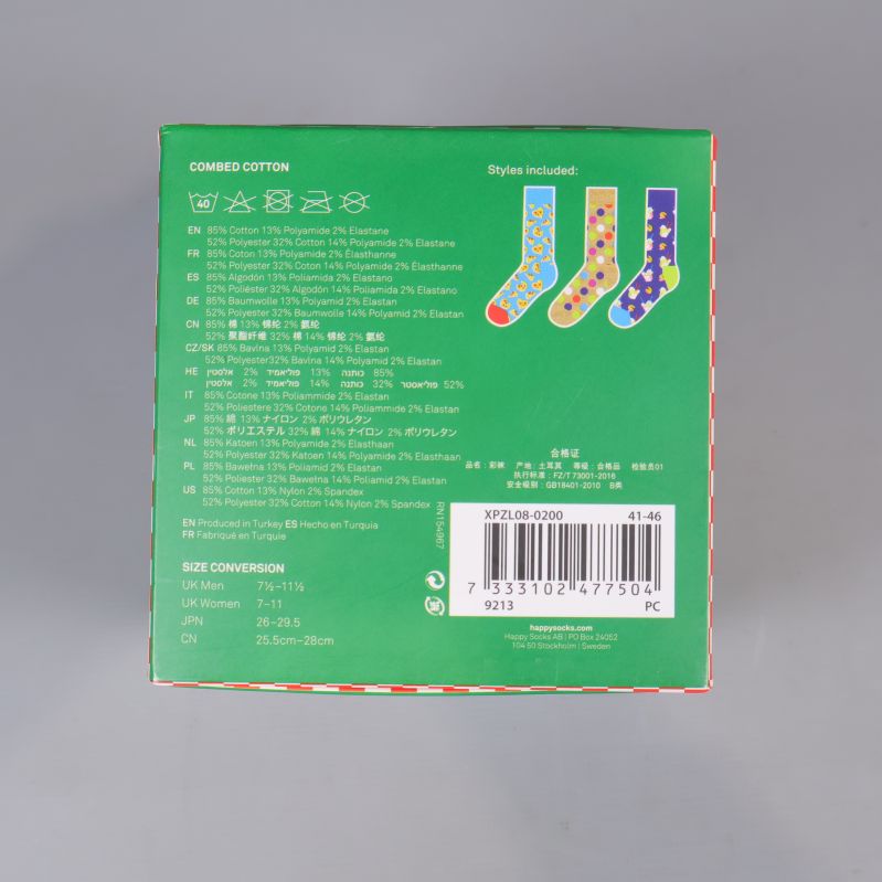 Baksidan av Happy Socks ask med materialinformation och storleksguide