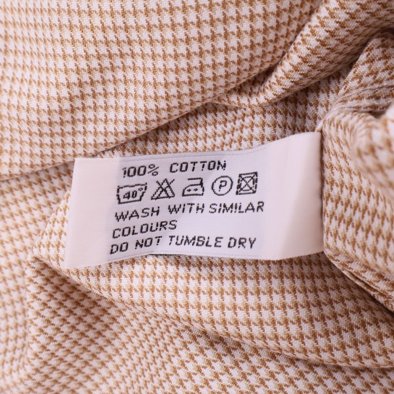 Materiallapp med text 100% cotton och tvättråd