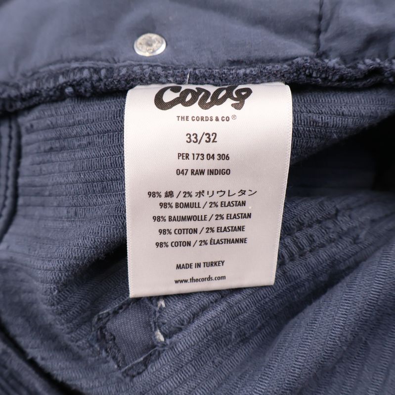 Materiallapp med information på insidan av byxorna