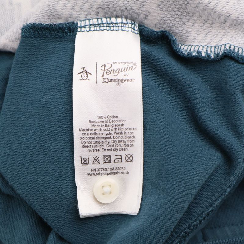 Materialetikett visar 100% bomull och skötselråd