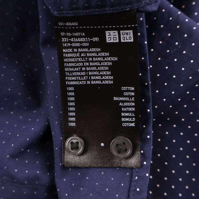 Materiallapp visar 100% bomull på Uniqlo-skjorta