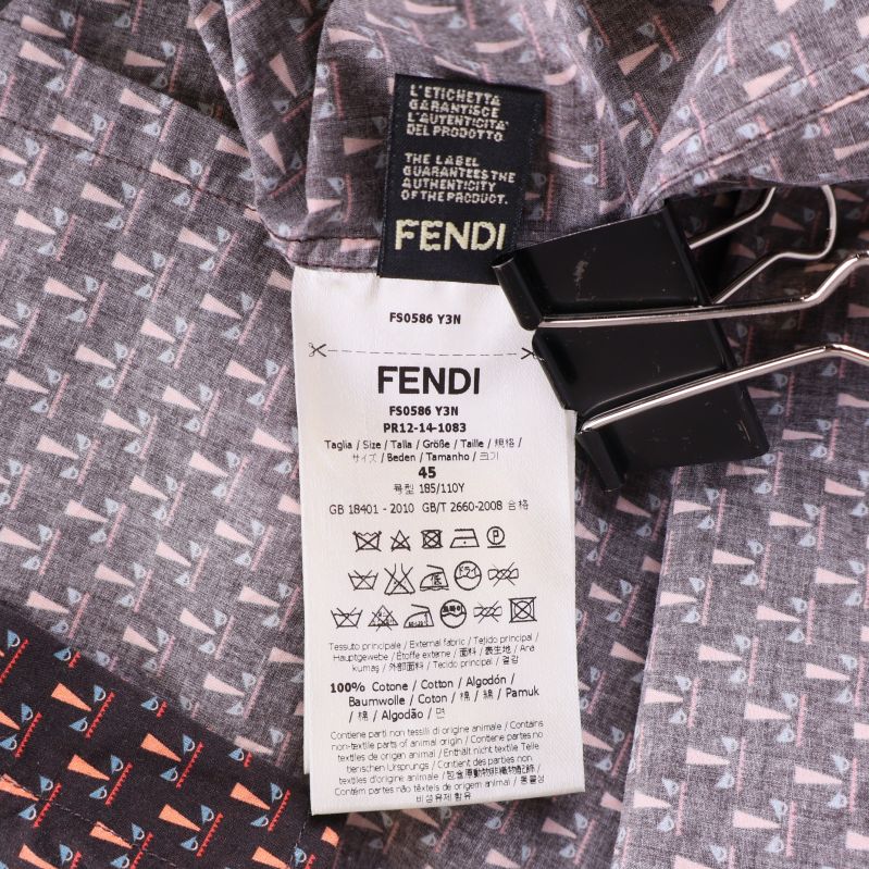 Material- och tvättetikett från Fendi inuti skjortan