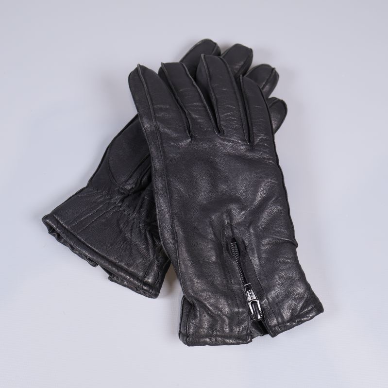 Svarta läderhandskar med dragkedja lagda omlott