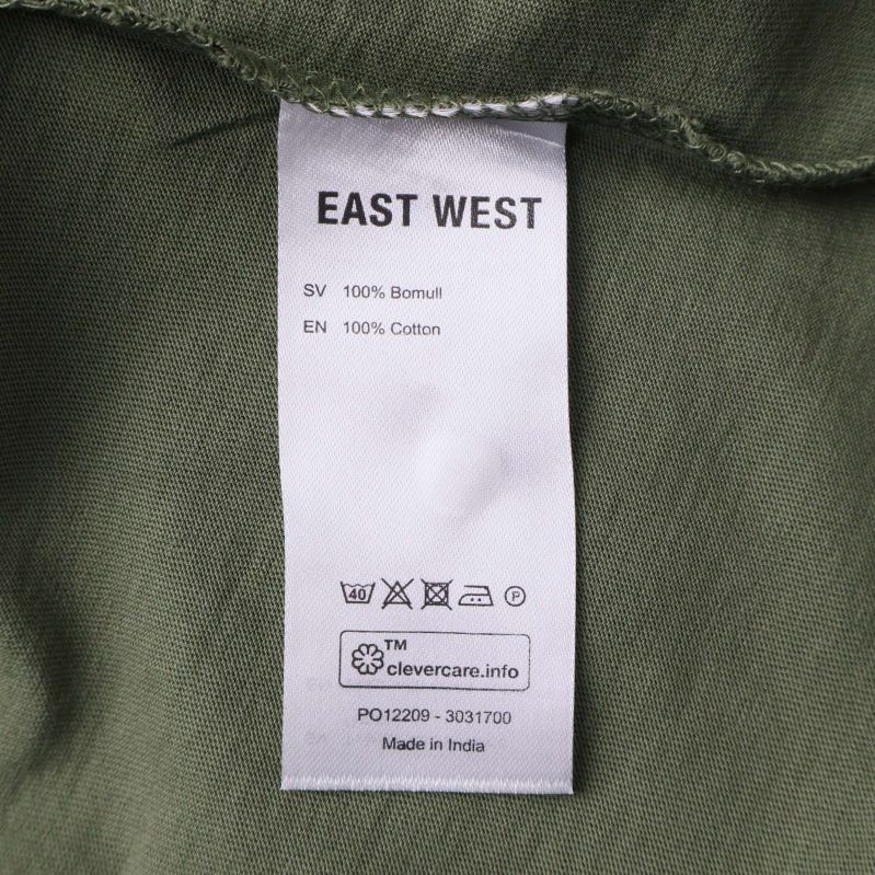 Materiallapp som visar 100% bomull