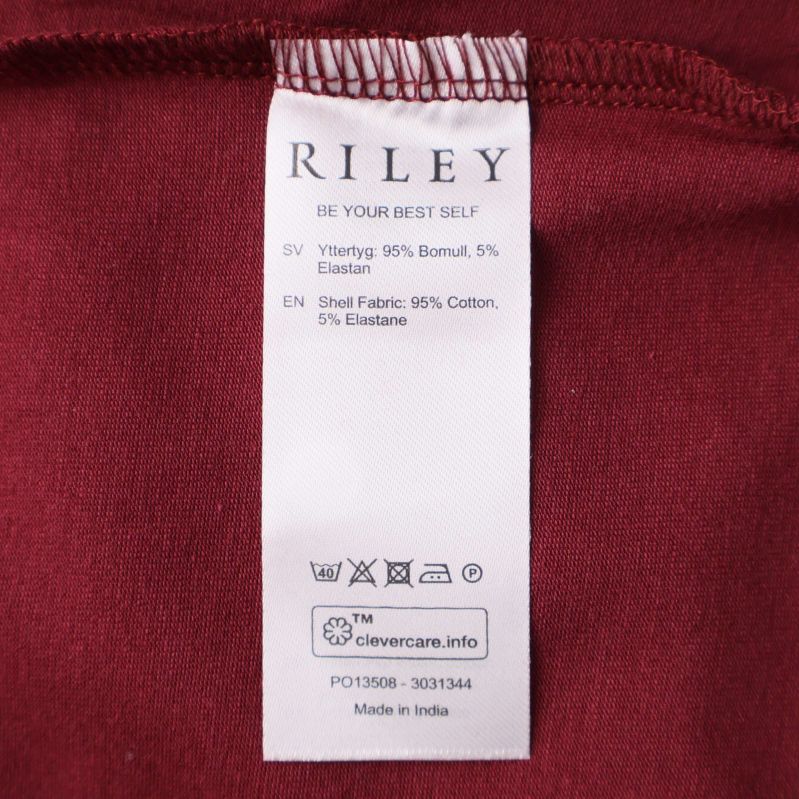 Materialetikett visar 95% bomull 5% elastan