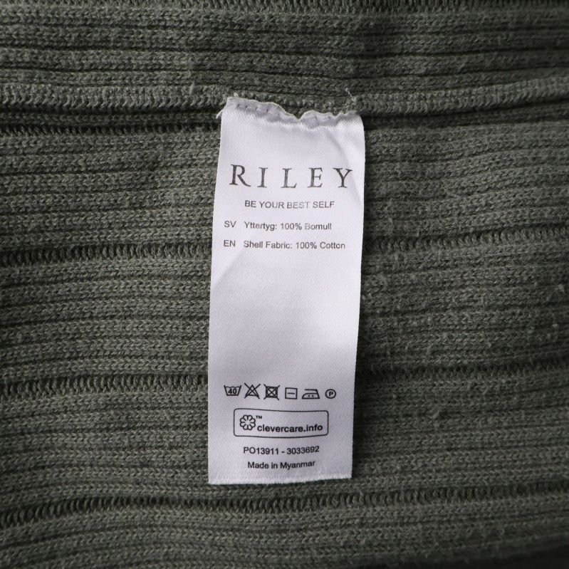 Materiallapp som visar 100% bomull