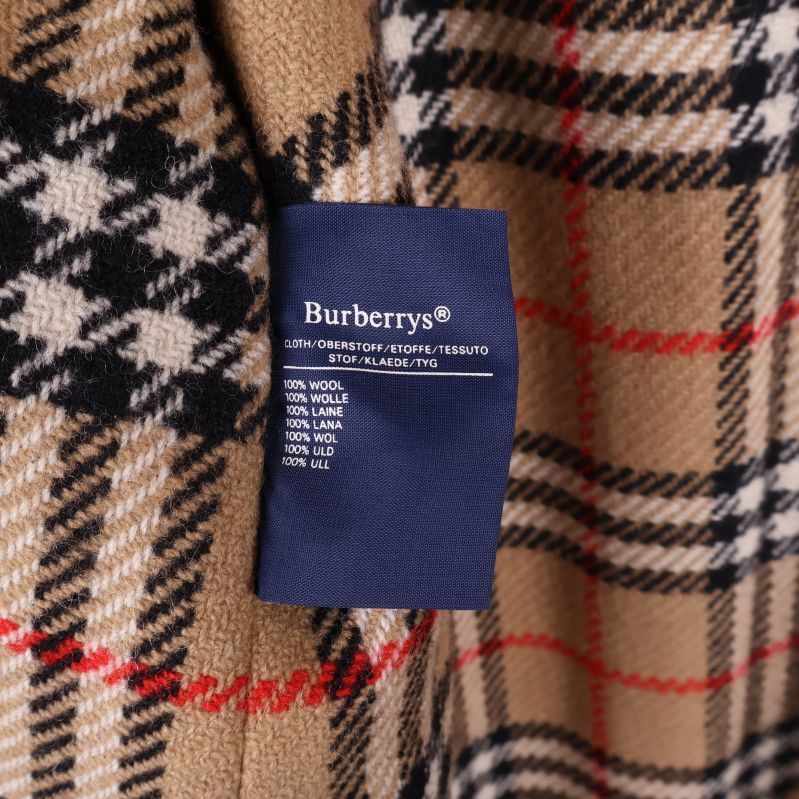 Materialetikett med information om ull och kashmir