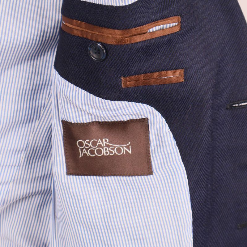 Insida av kavaj med Oscar Jacobson-märke och randigt foder