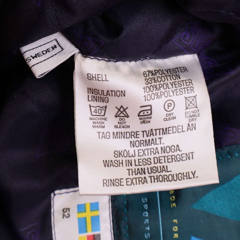 Materiallapp med information på skidbyxor