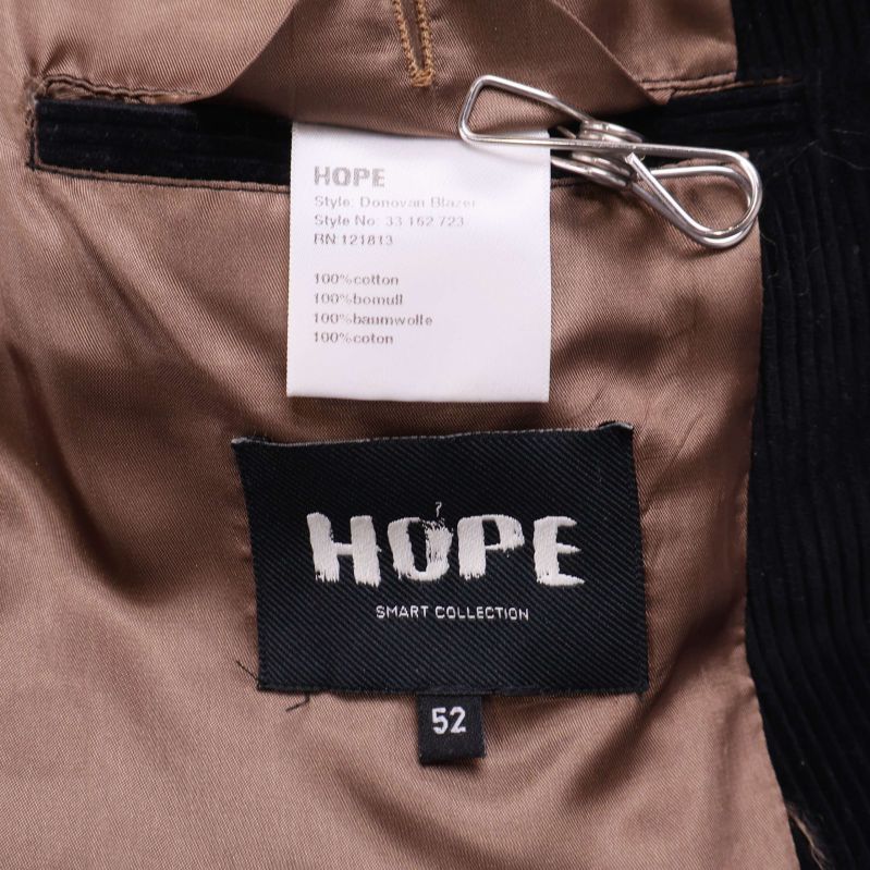 Hope etikett samt materiallapp i kavaj