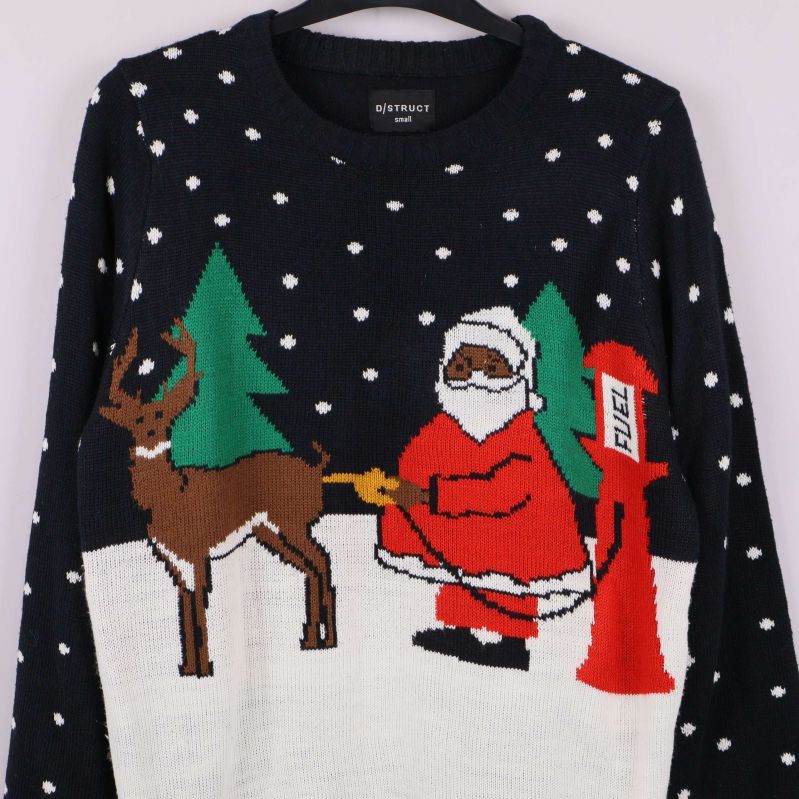 Detaljbild på tomte och ren med julmönster