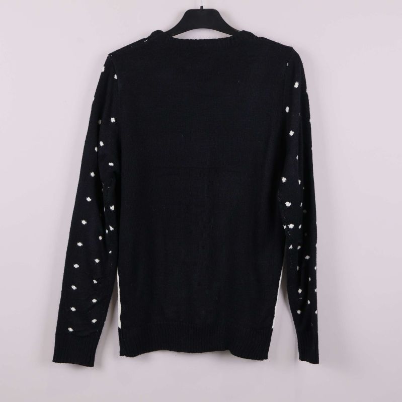 Baksida av jultröja i svart med vita prickar