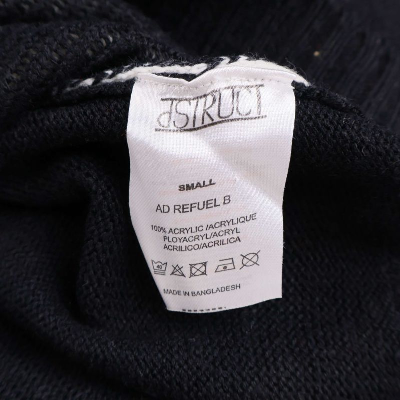 Materiallapp visar 100% akryl på D/STRUCT-tröjan