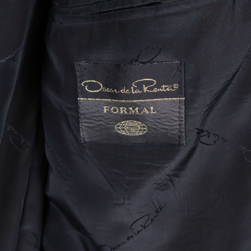 Närbild av Oscar de la Renta-logo 